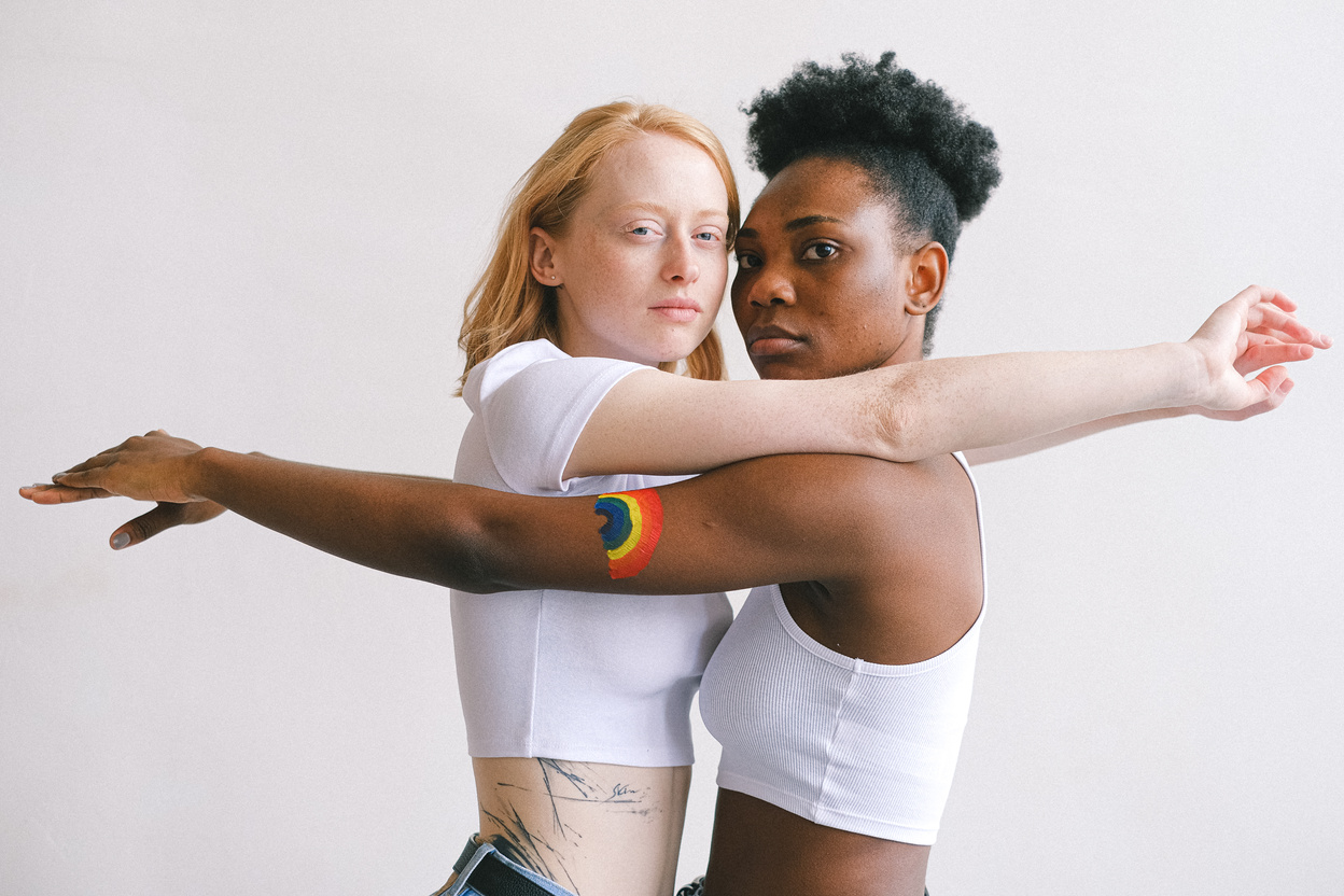 Women With Arms Outstretched Looking at the Camera