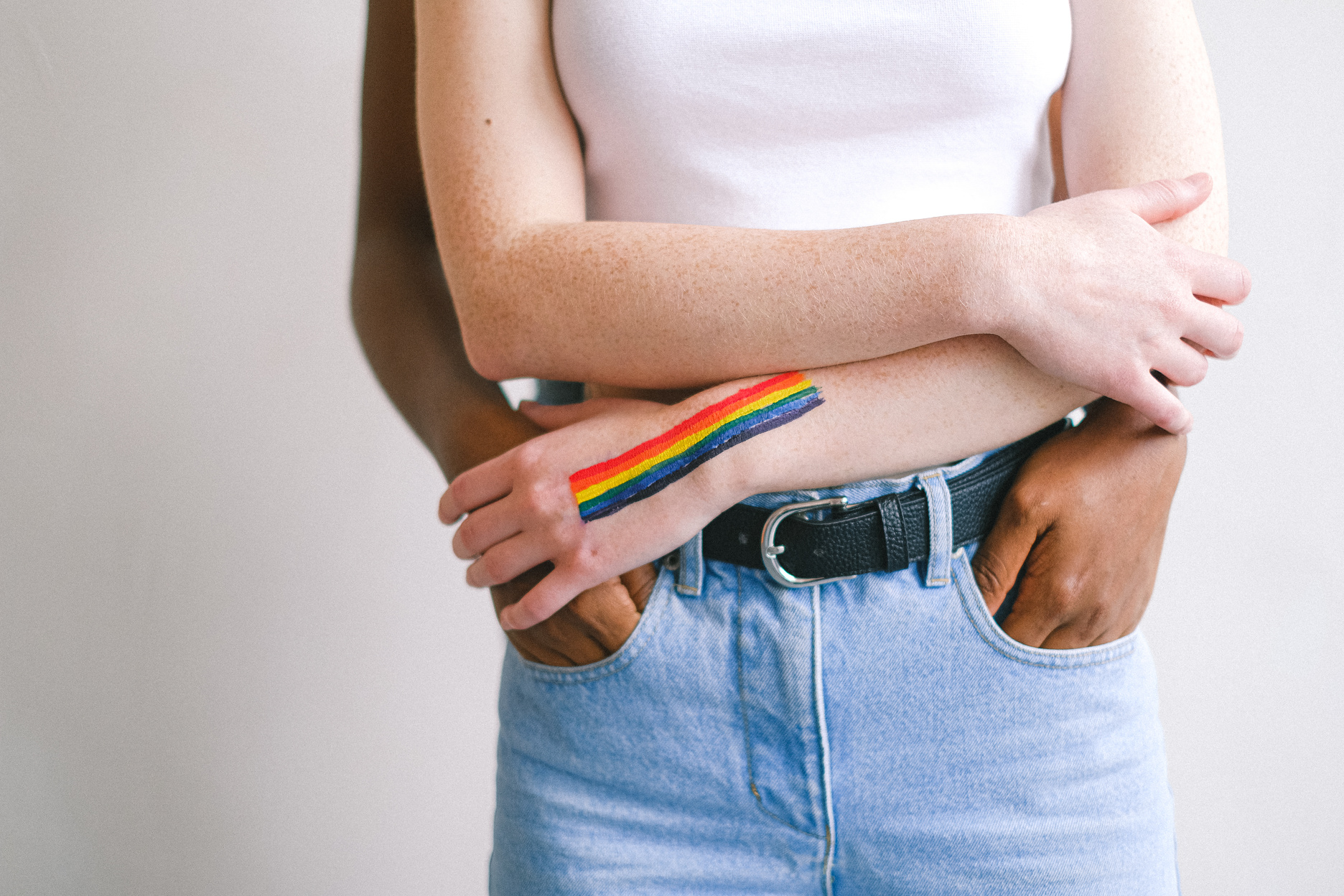 Woman With Gay Pride Body Paint on her Hand