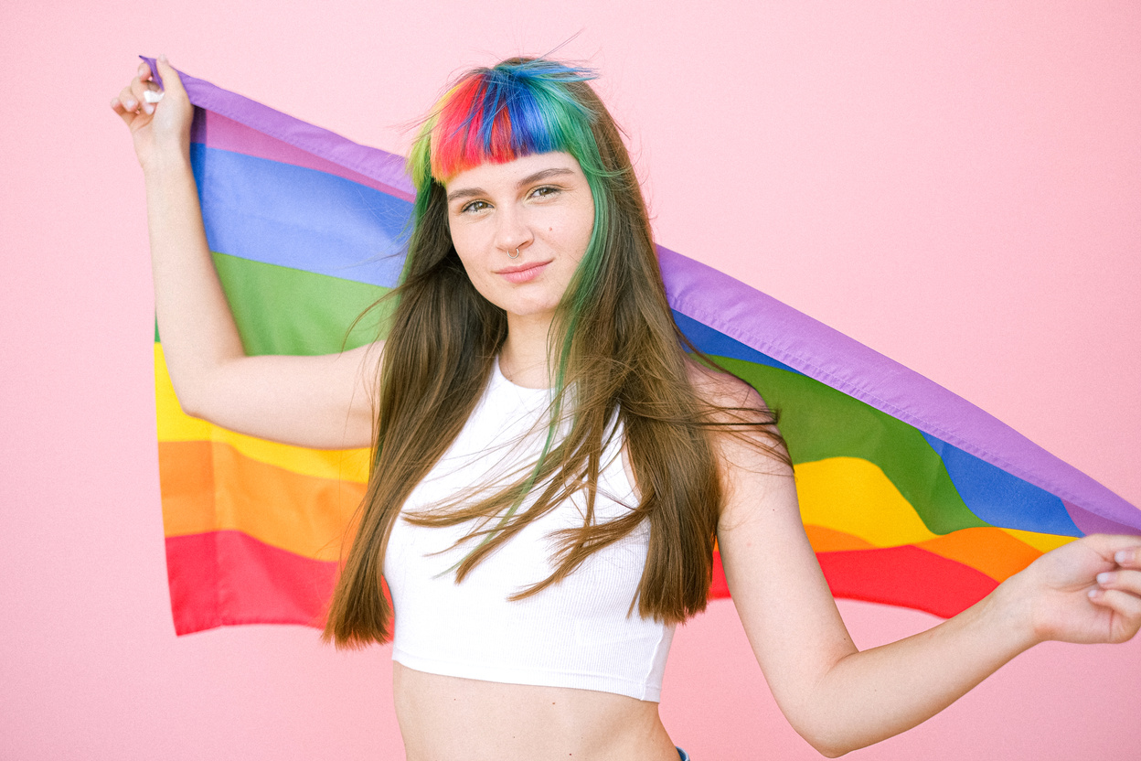 Woman Holding a Gay Pride Flag